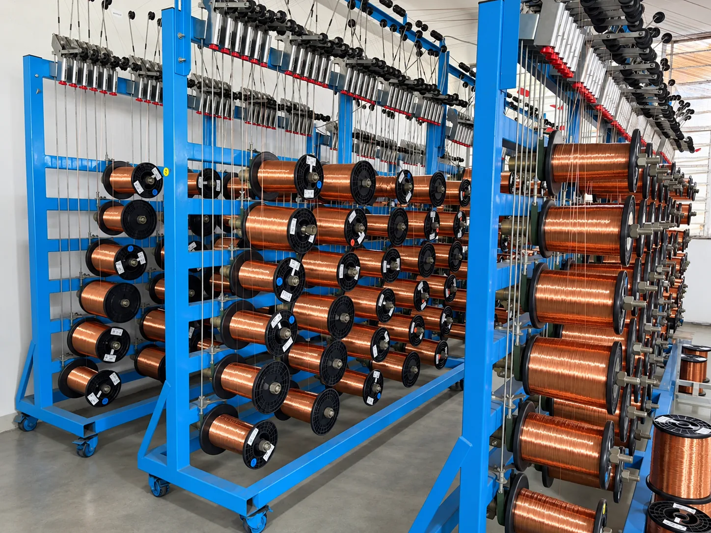 Wire processing equipment used in magnetic component manufacturing at KATOY